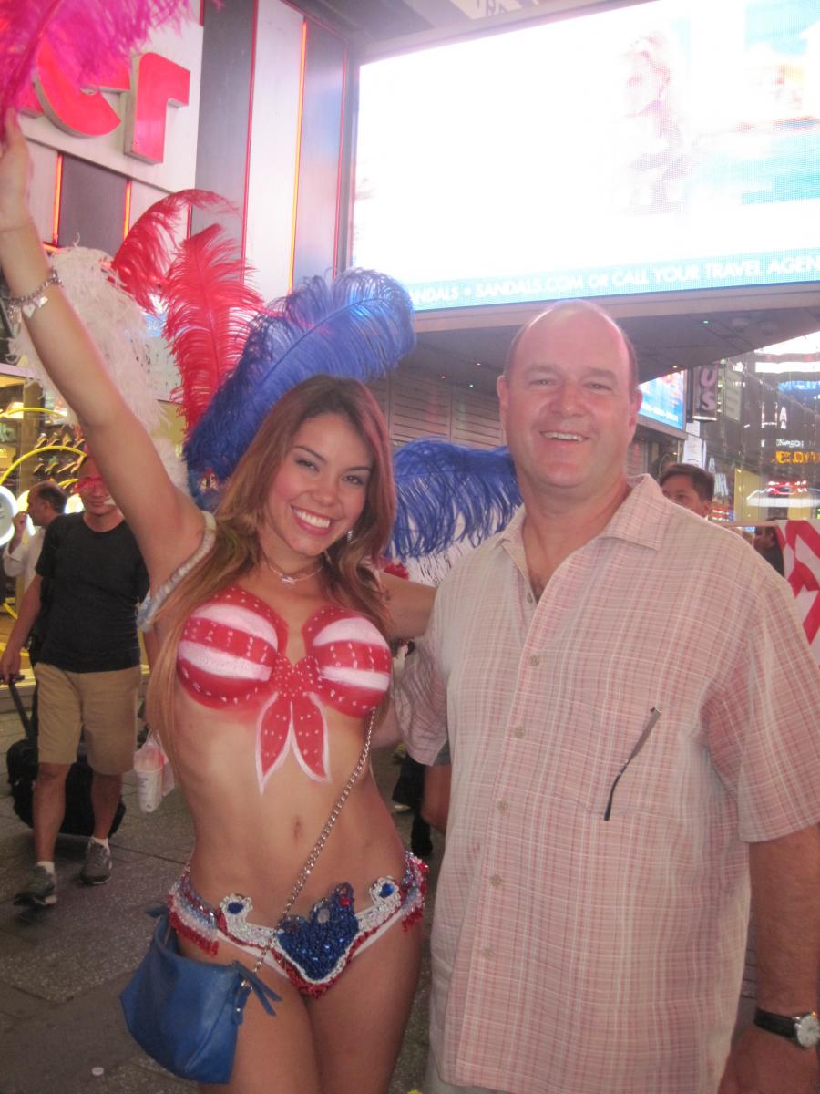 The author's husband poses with one of Times Square's 